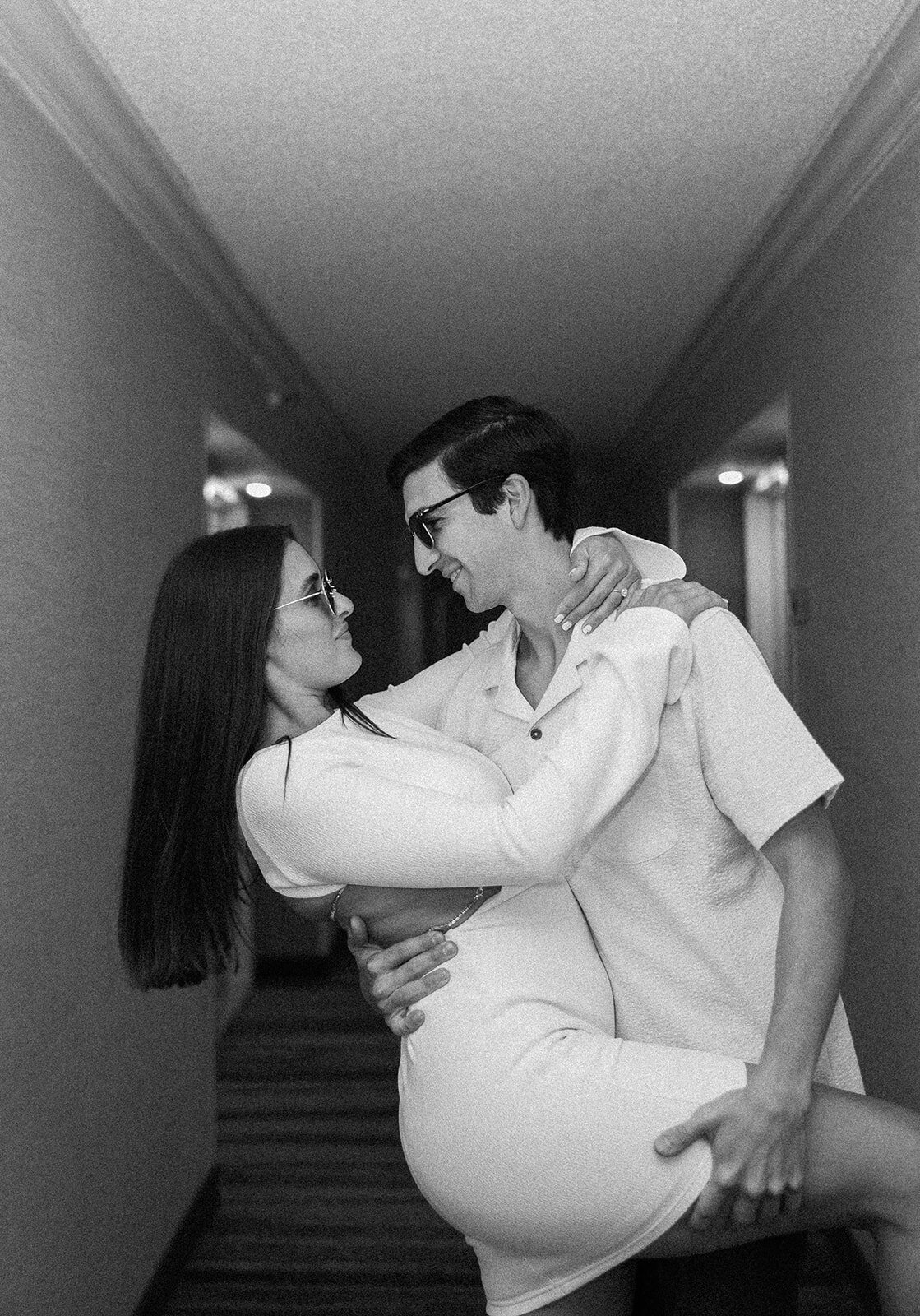 Rebecca and Graysen, silhouetted in a black and white moment, share an emotional embrace, symbolizing their love during their Marriott Hotel Fort Lauderdale engagement session.