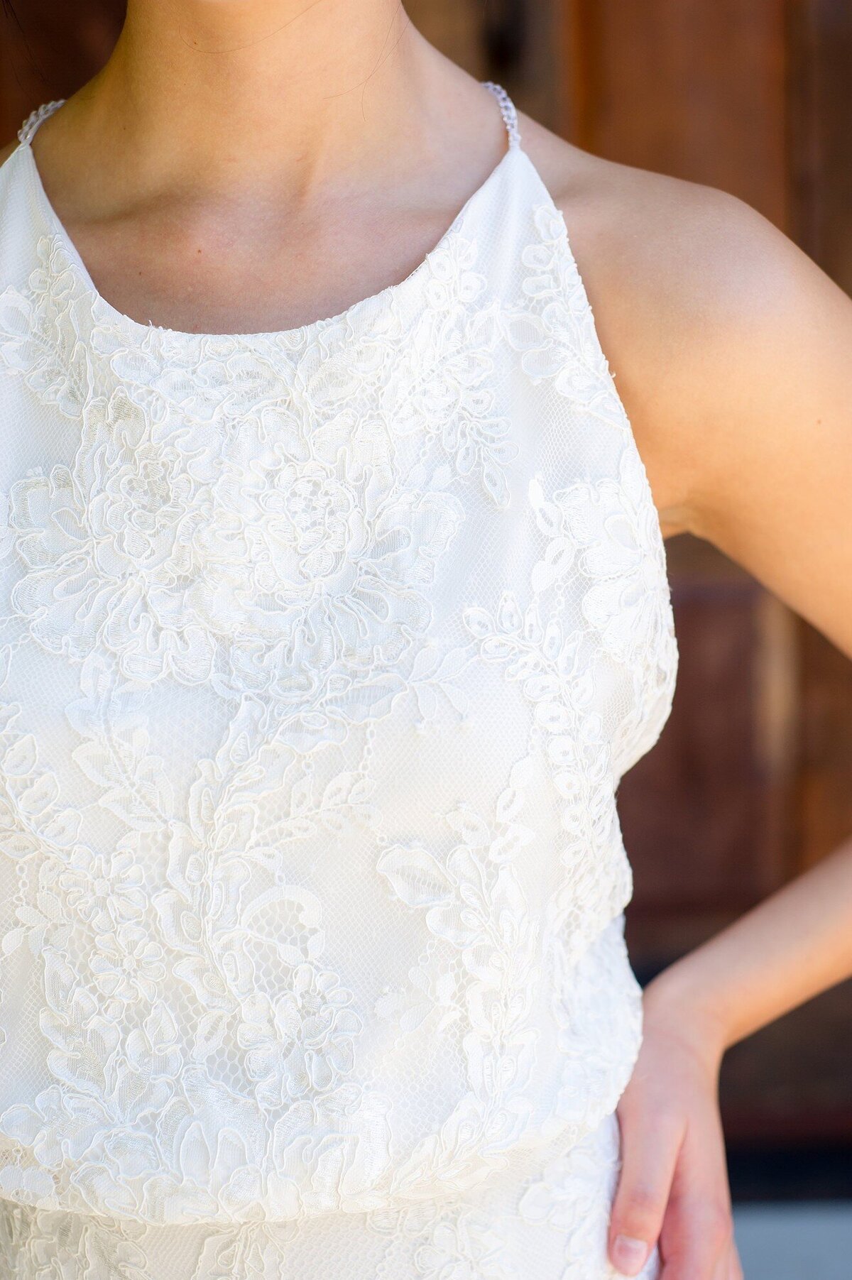 Sabine's lace is a floral pattern with a re-embroidered cord detail for a subtle texture. A crepe fabric acts as the base layer under the lace.