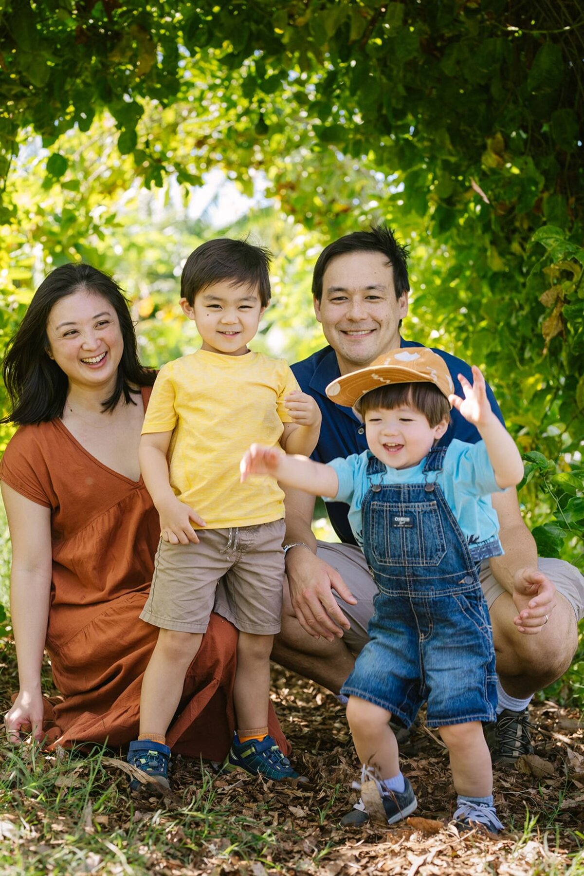 family of 4 laughing at keiki and plow farm