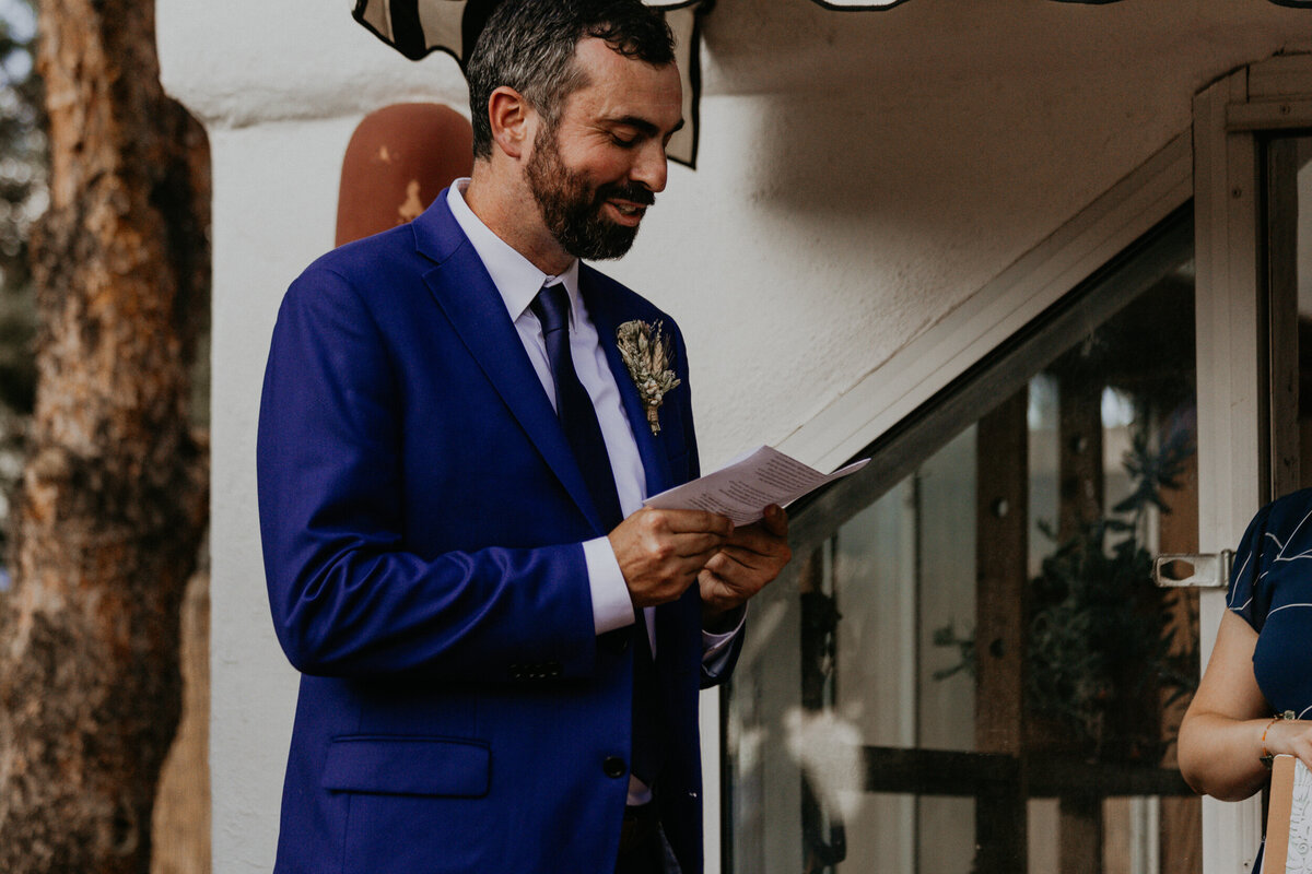 groom reading vows during ceremony