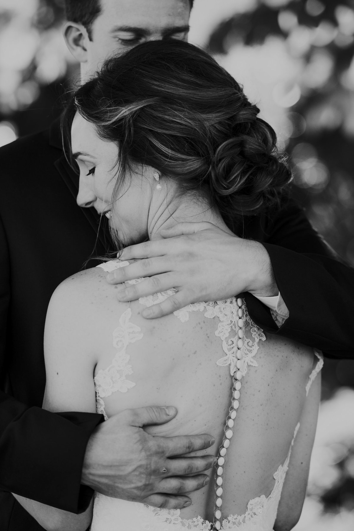 Emotional bride and groom backless dress