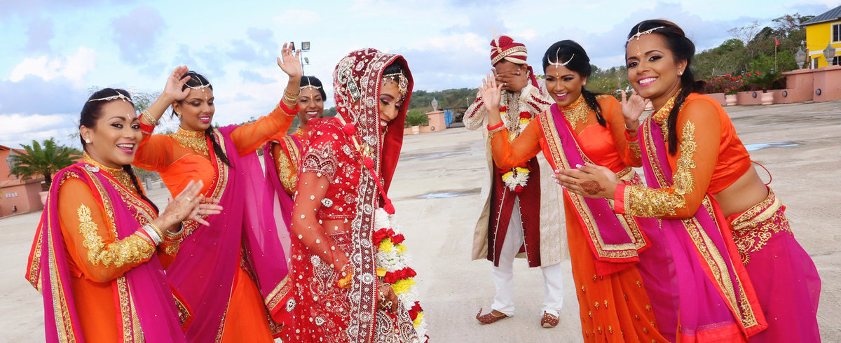 Candid shot of bridal party with hindu couple. Photo by Ross Photography, Trinidad, W.I..