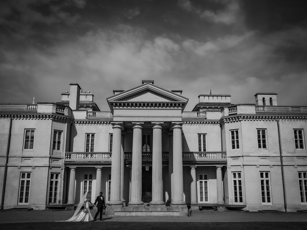 bride groom walking in front of dundurn castle