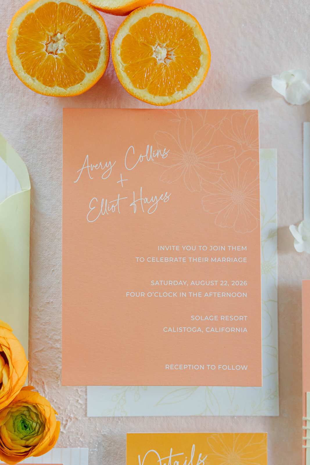 orange-invitation-flatlay-with-sliced-citrus