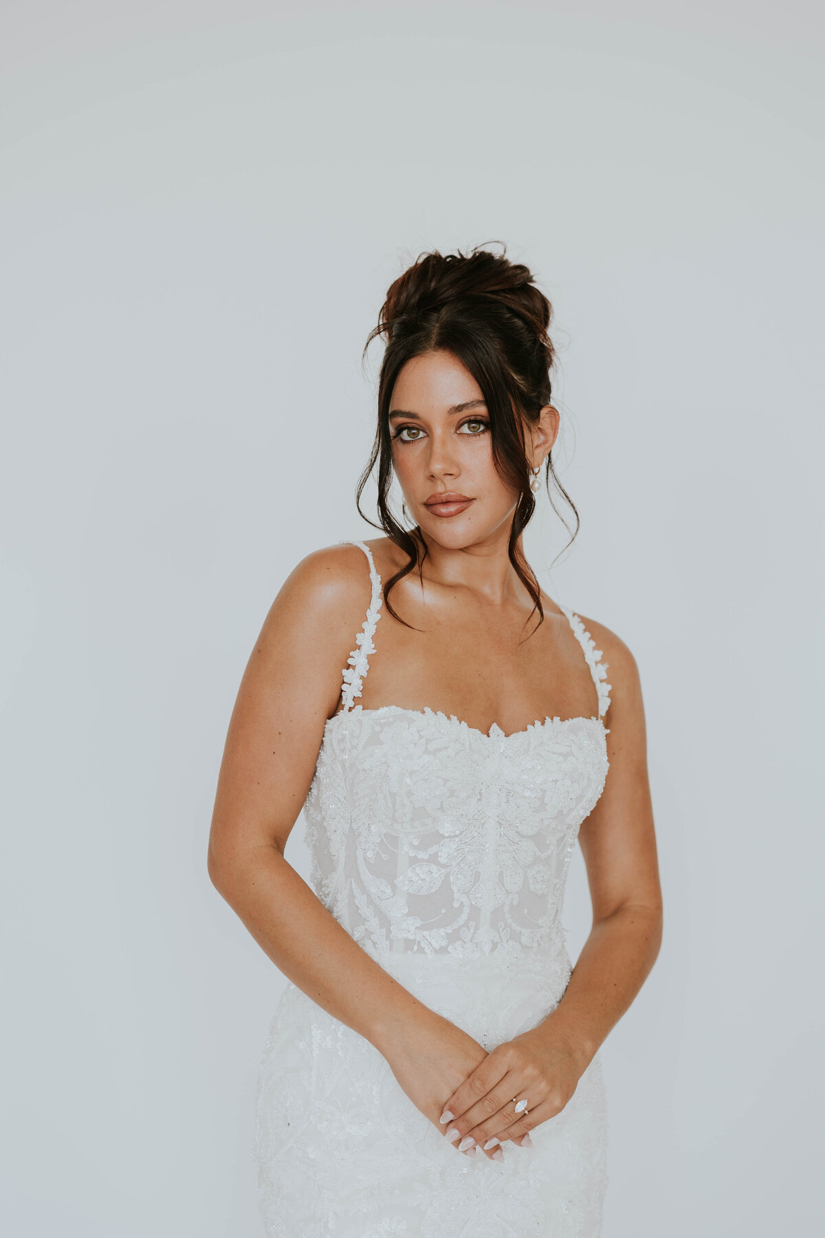 bride posing with heart shaped sunglasses