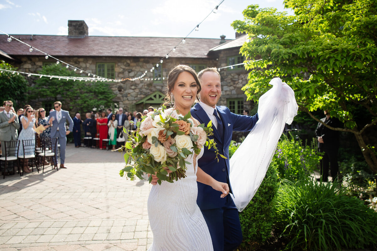 bride-and-groom-celebrate-after-ceremony-willowdale-lisa-gilbert-photography