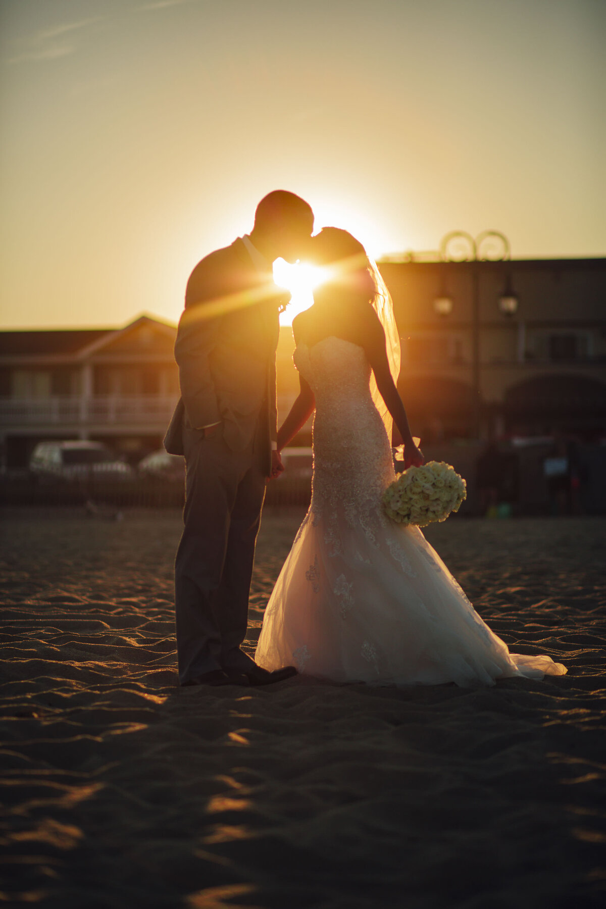 long-branch-beach-wedding-couple-kissing-at-sunset-summer-evening-new-jersey