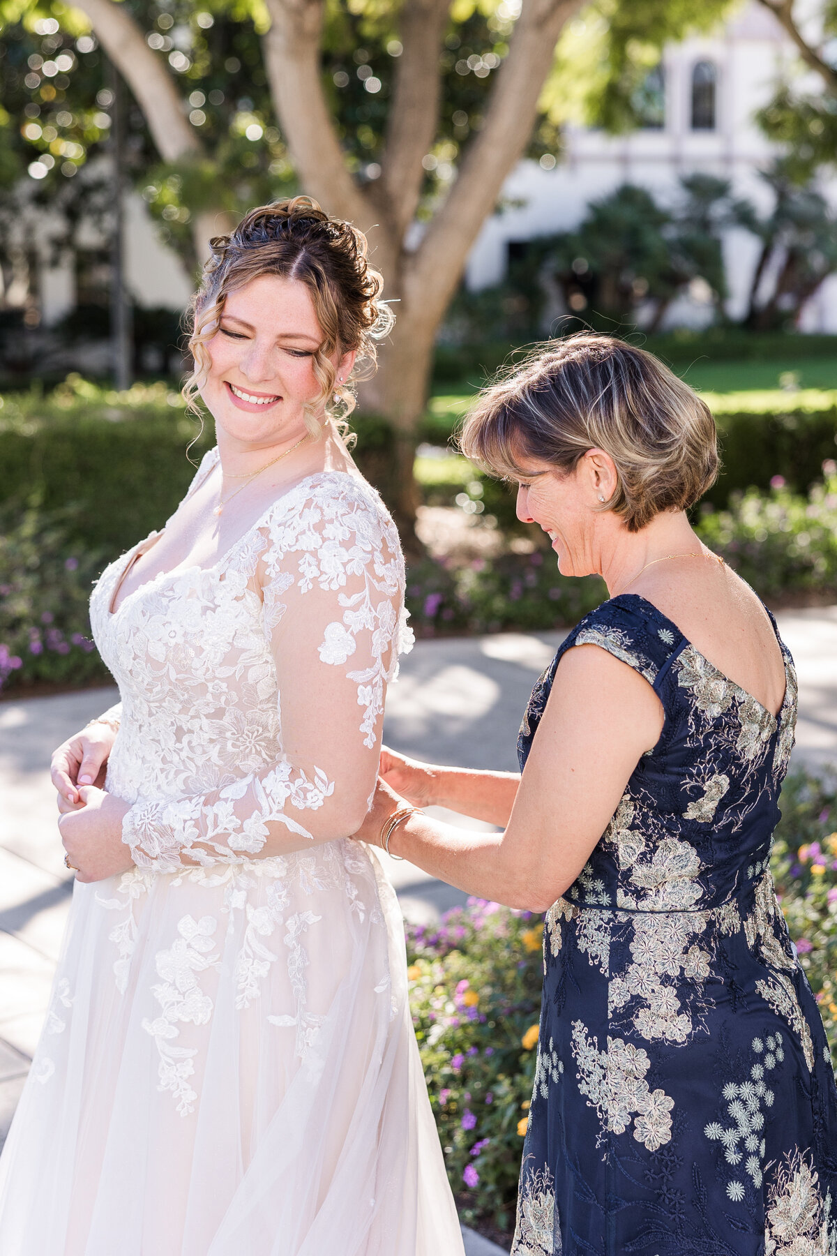 mother-buttoning-bride's-dress