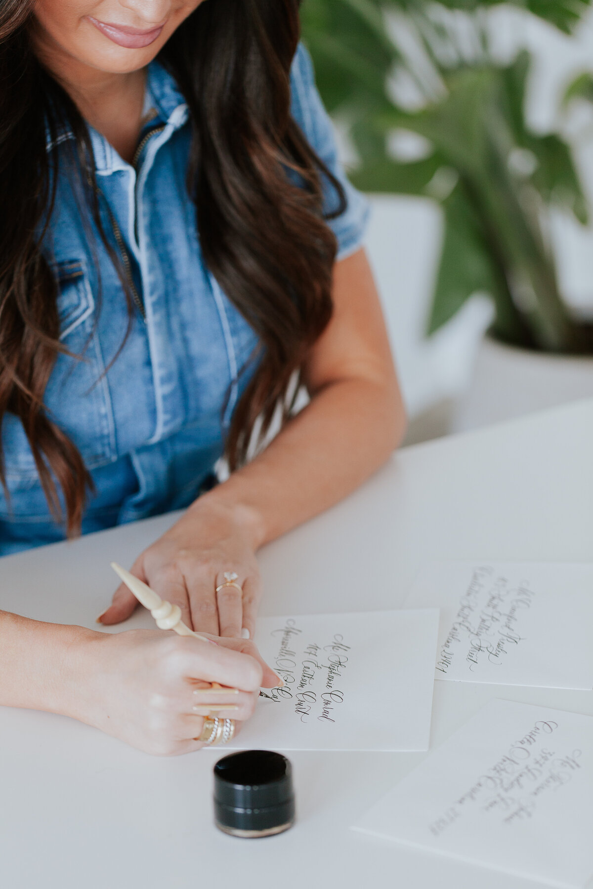 overhead-image-calligrapher-addressing-envelopes-for-brand-session-the-frame-charlotte