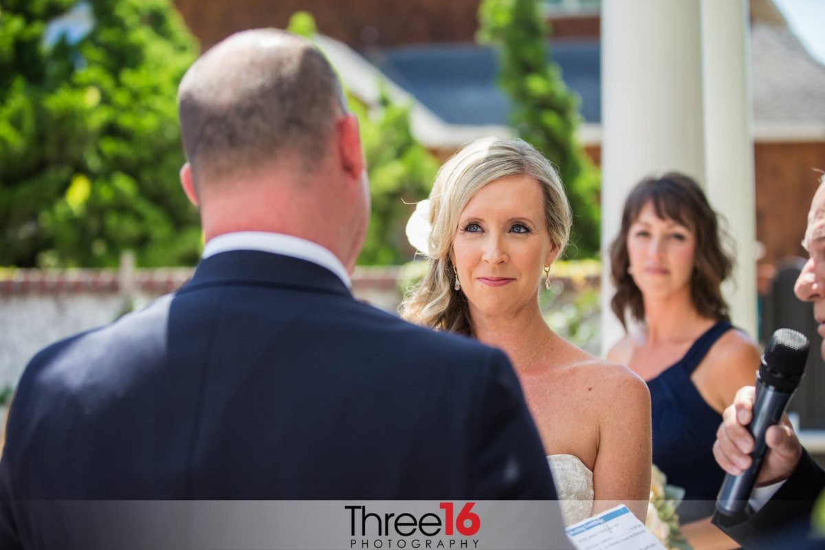 Bride stares at her Groom during wedding ceremony
