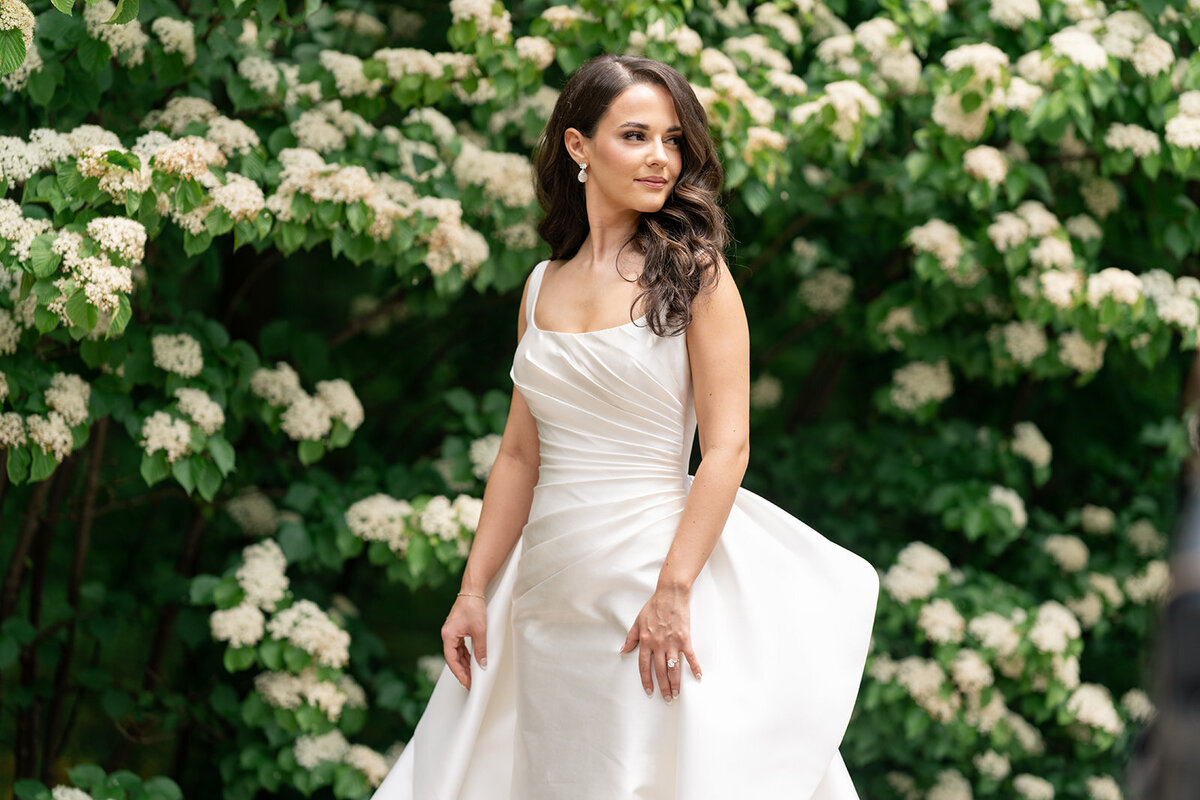 a bride in an elegant white wedding dress