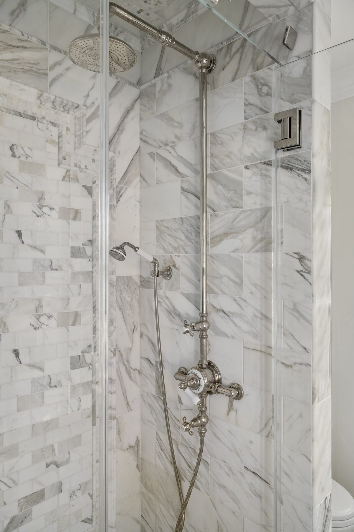 candra lynn interiors ocean port project bathroom shower with silver finishes