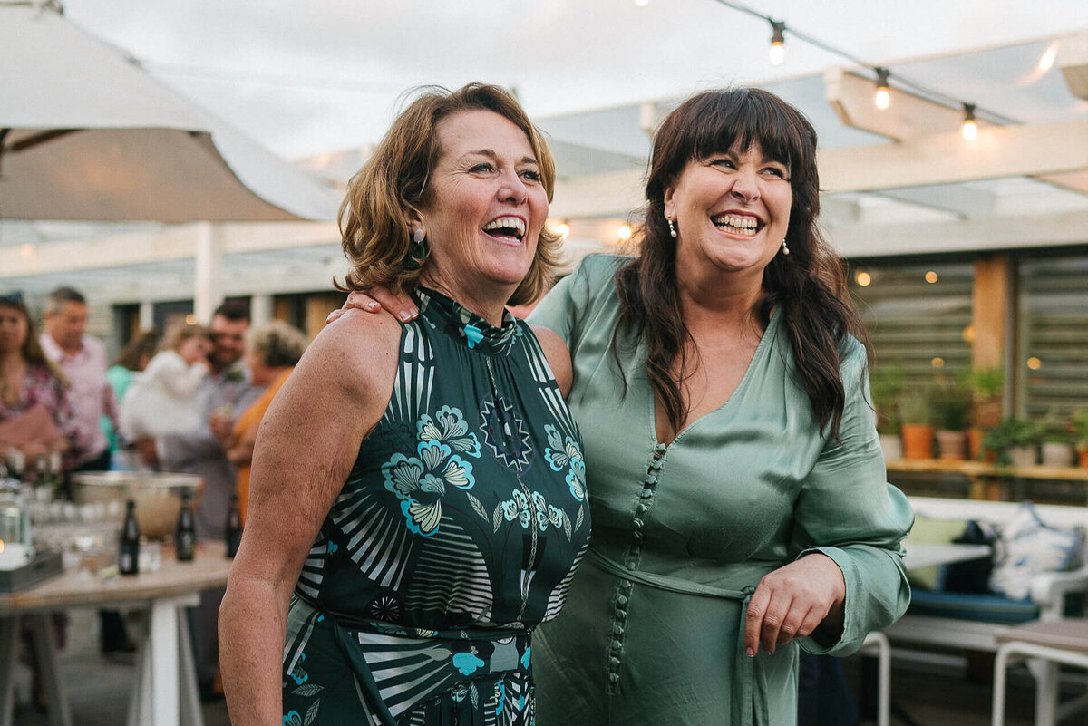 Wedding guests laughing at a wedding