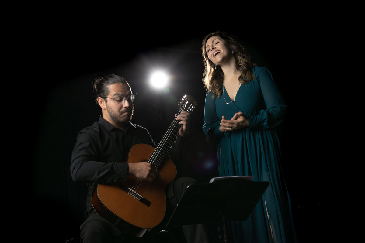 Amy Canchola performs with guitarist