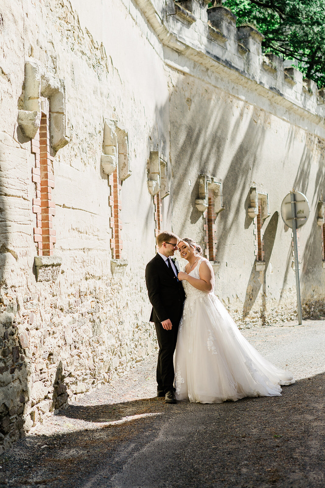 Bride walking through the streets during a Loire Valley elopement, captured in a natural and romantic style