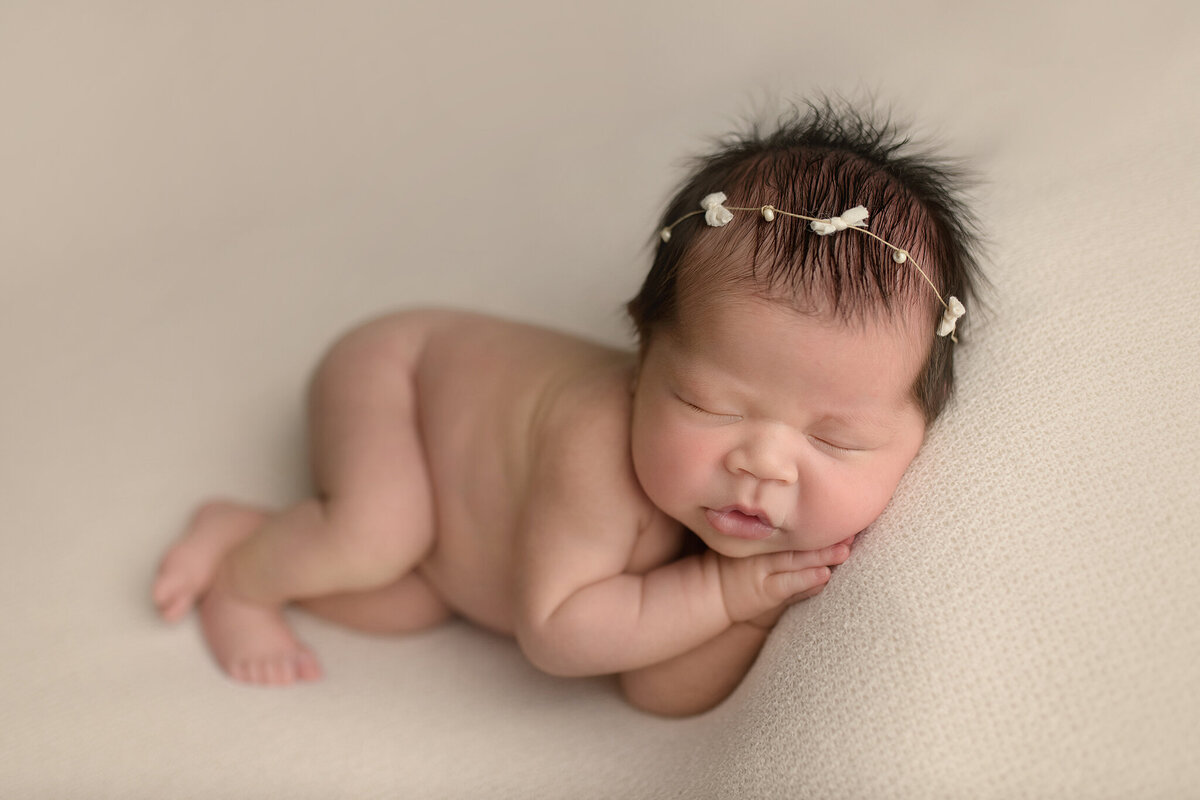 Sleeping newborn baby girl