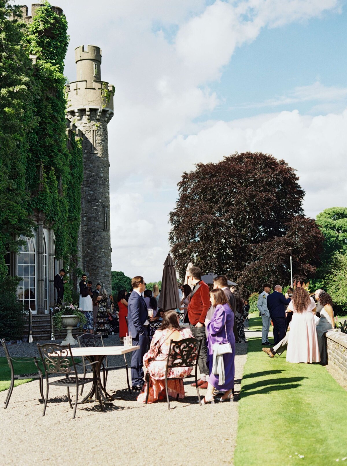 A wedding photo of guests during cocktail hour at Luttrellstown Castle in Ireland