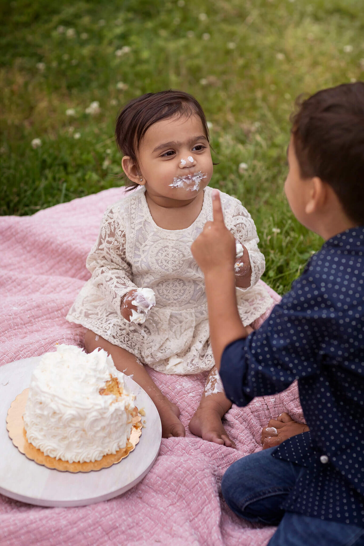 NJ first birthday cake smash photography session with little girl and her yummy cake