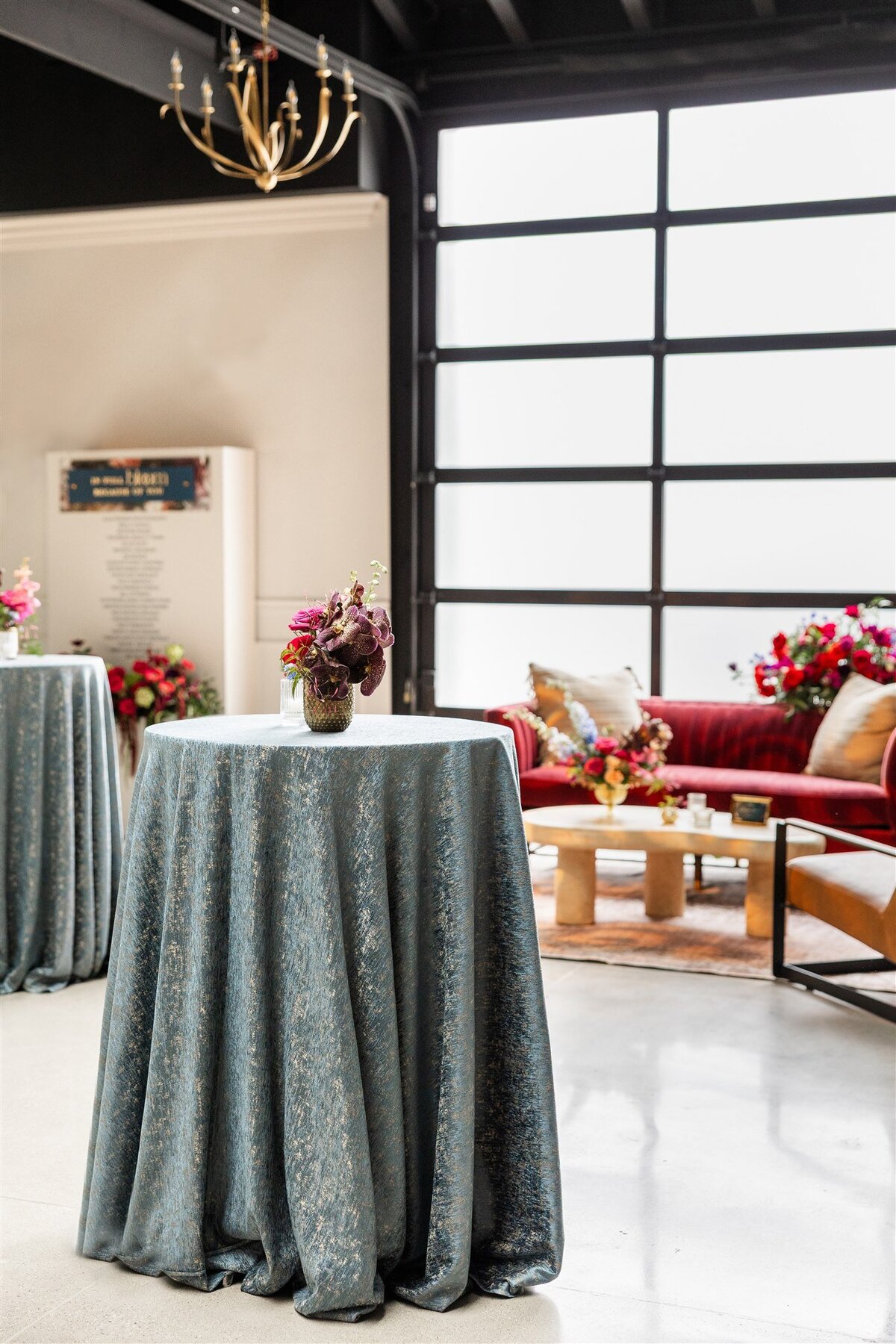 Event space styled with a Baroque theme, featuring ornate gold accents, rich fabrics, grand chandeliers, and intricate moldings, creating a luxurious and dramatic atmosphere