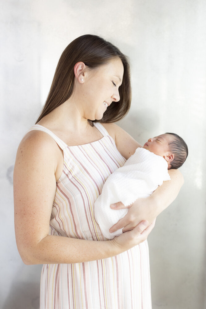 portrait of mom holding baby boy