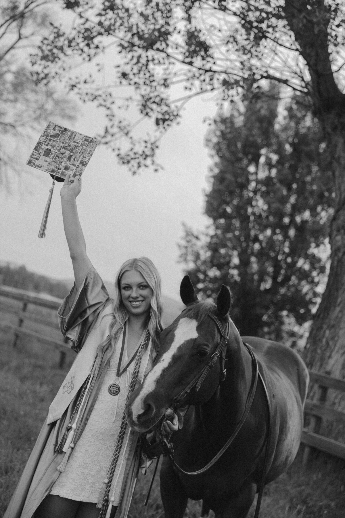 Western Senior Portrait of Girl in Black Cowboy Hat and White Sweater Smiling in Golden Light