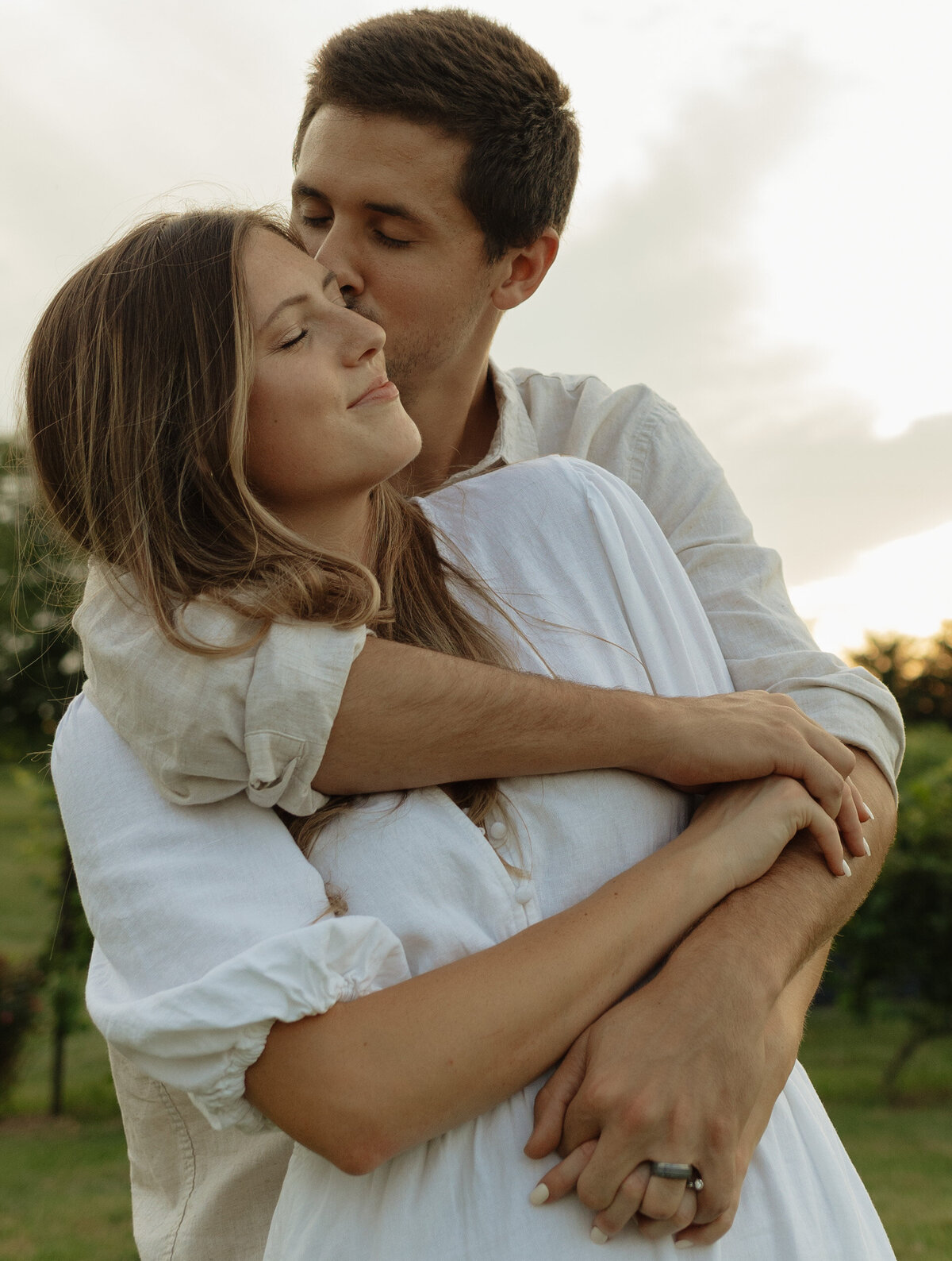 Intimate winery picnic session with lush palm trees and bright natural light

