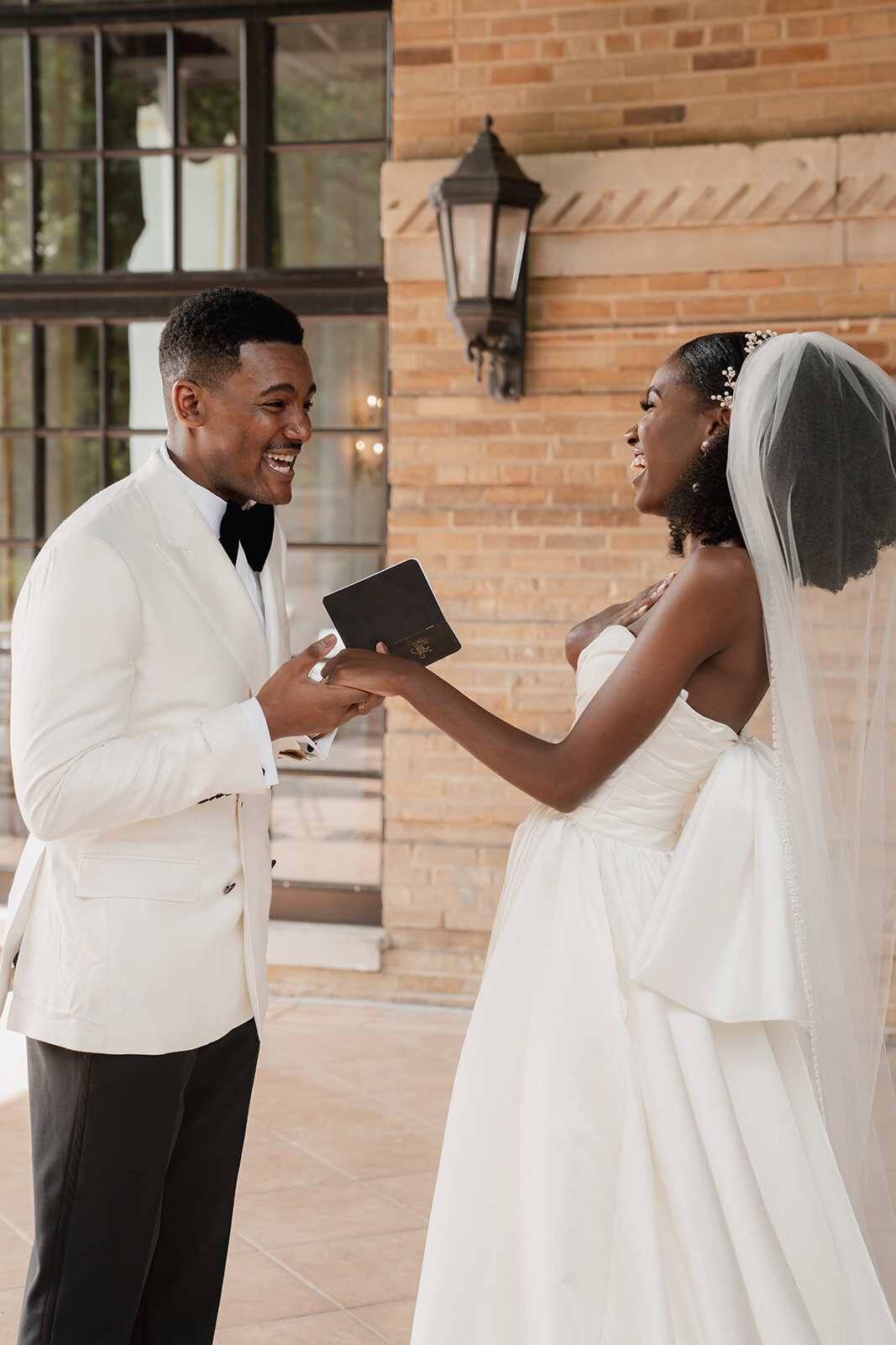 black bride and groom smiling on wedding day
