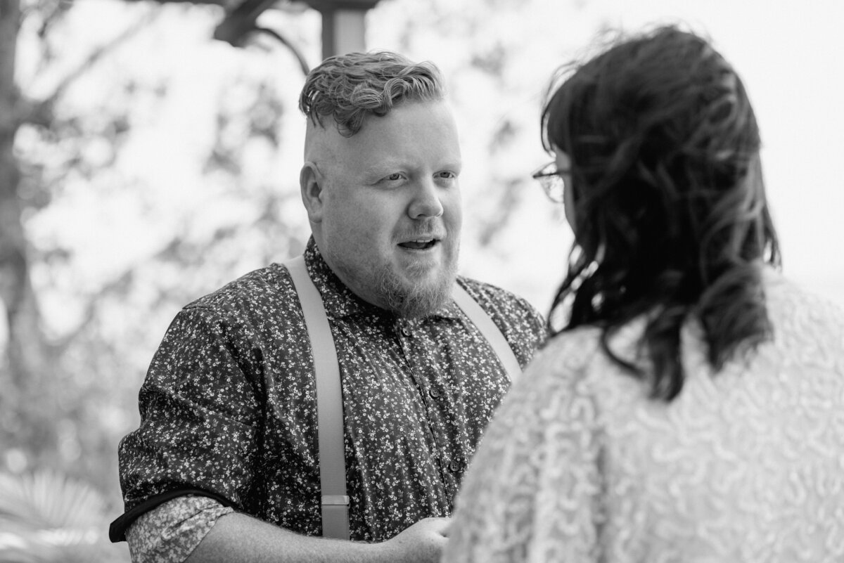 lake erie elopement groom reads vows to bride
