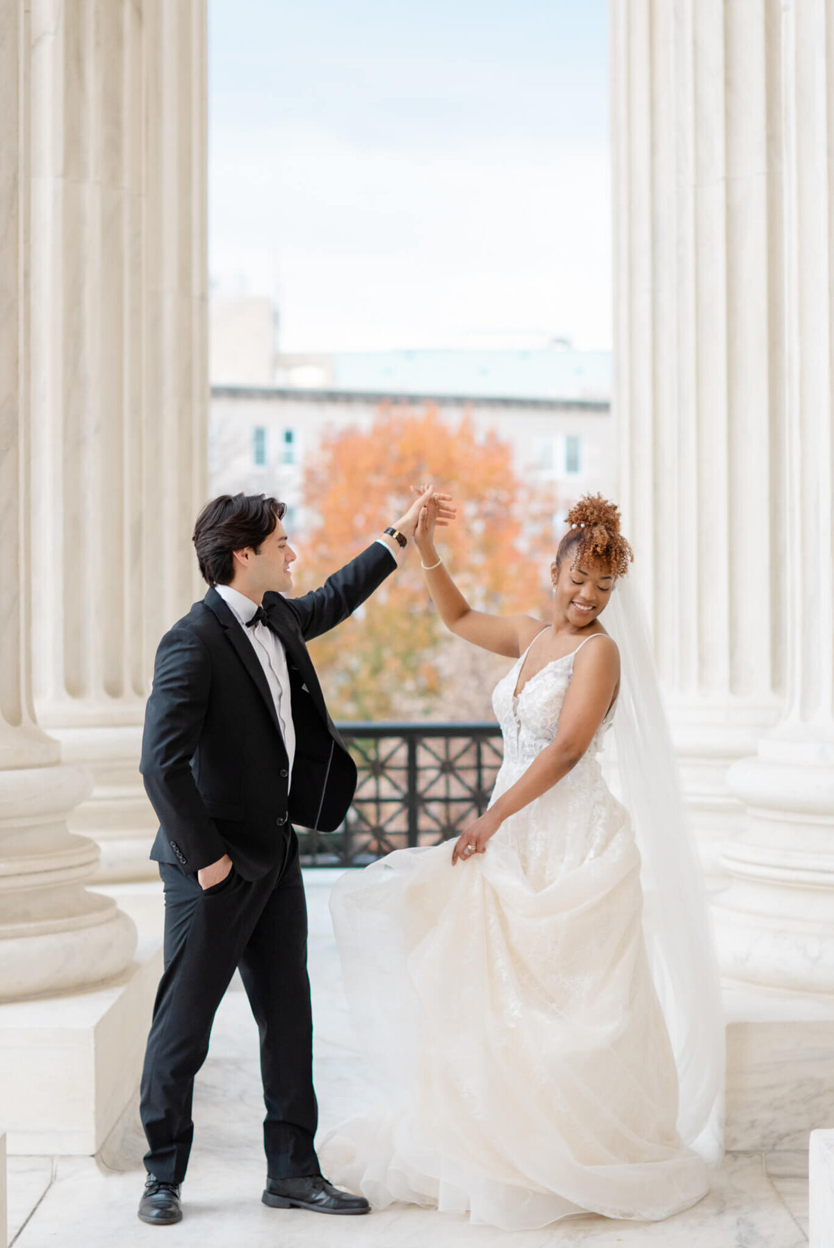 Bride and groom twirling at the Supreme Court in Washington, DC. Captured by Charlottesville Wedding Photogapher Bethany Aubre Photography.