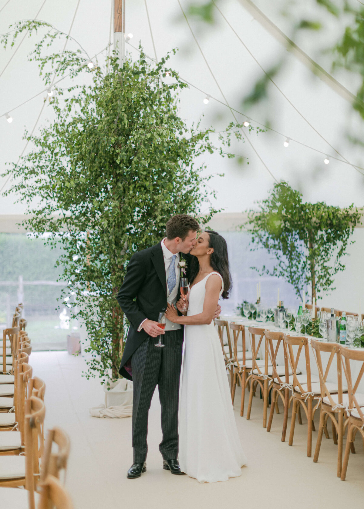 chloe-winstanley-weddings-bride-groom-kiss-sperry-tent