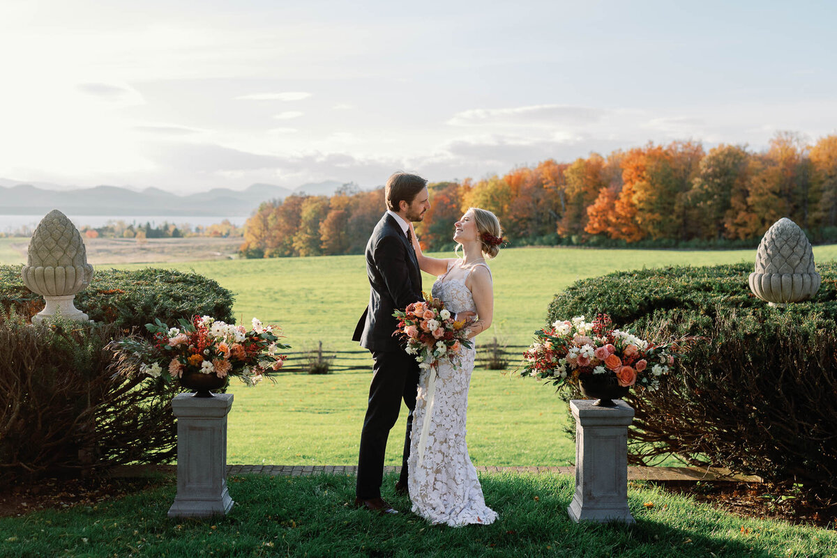 bride and groom kiss at brick house shelburne museum wedding in the fall wedding