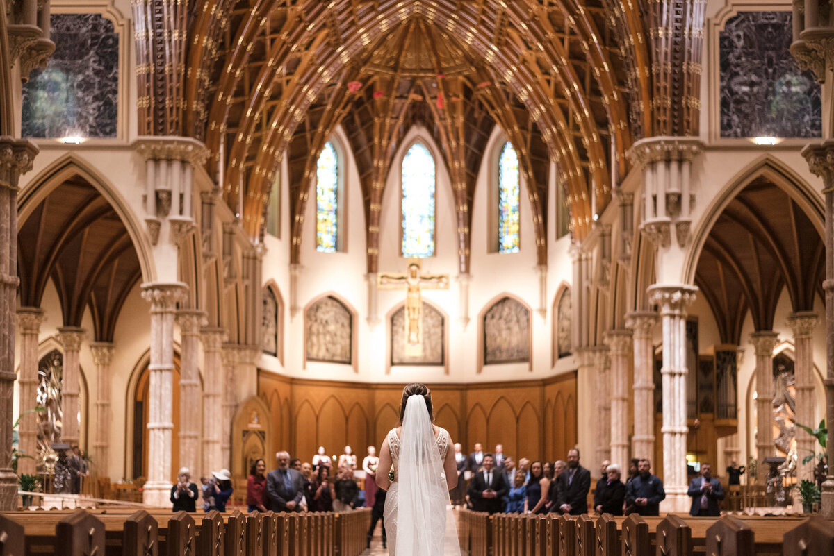 Bride walks down the aisle at Holy Name Church in Chicago, IL