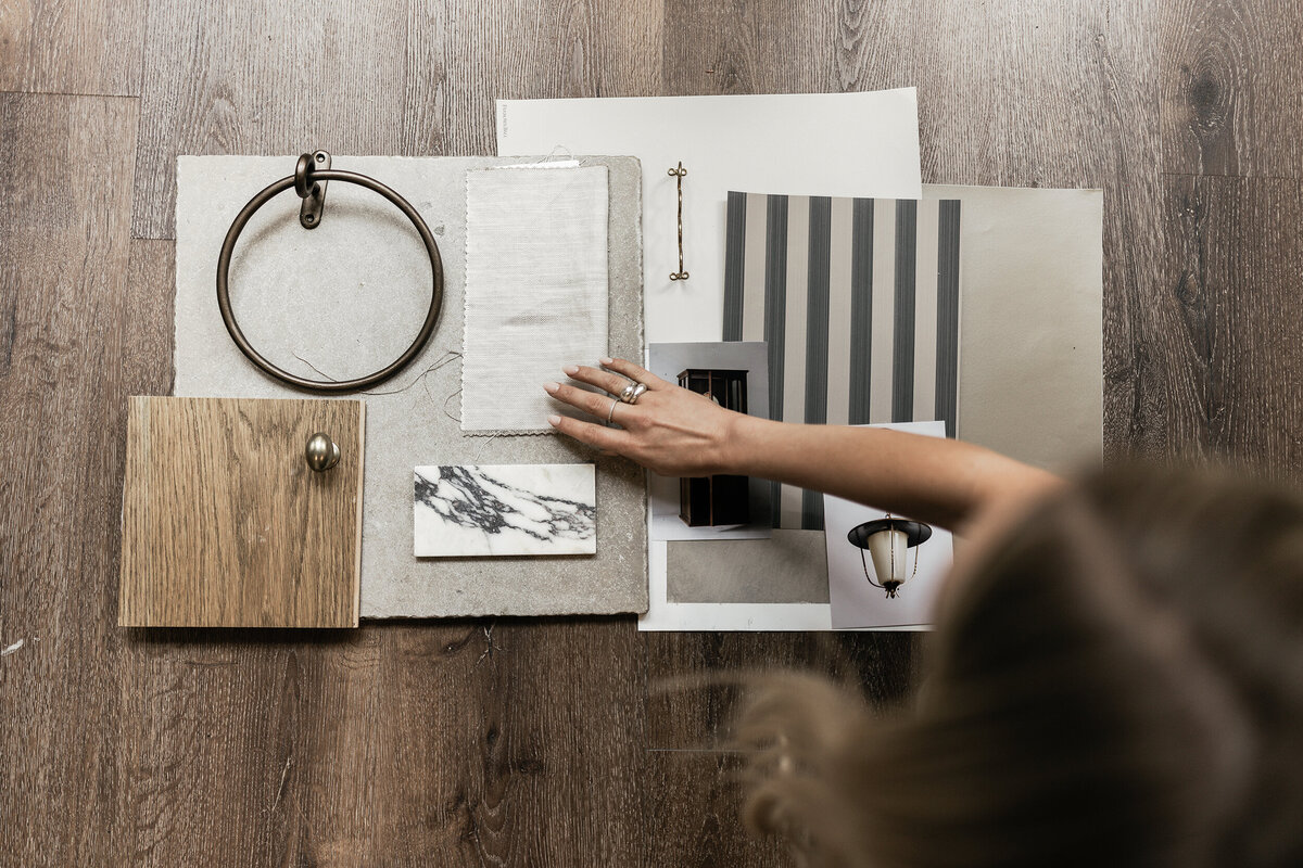 Overhead flatlay of interior design samples including wood, marble, fabric, and hardware — branding image by Dani Lacey Photographs in Greenville SC photographer.