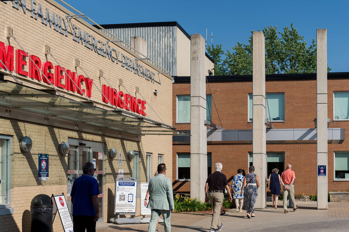 Ottawa event photography showing attendees of the KDH CT Suite grand opening walking into the hospital to go view the Suite. Captured by JEMMAN Photography COMMERCIAL