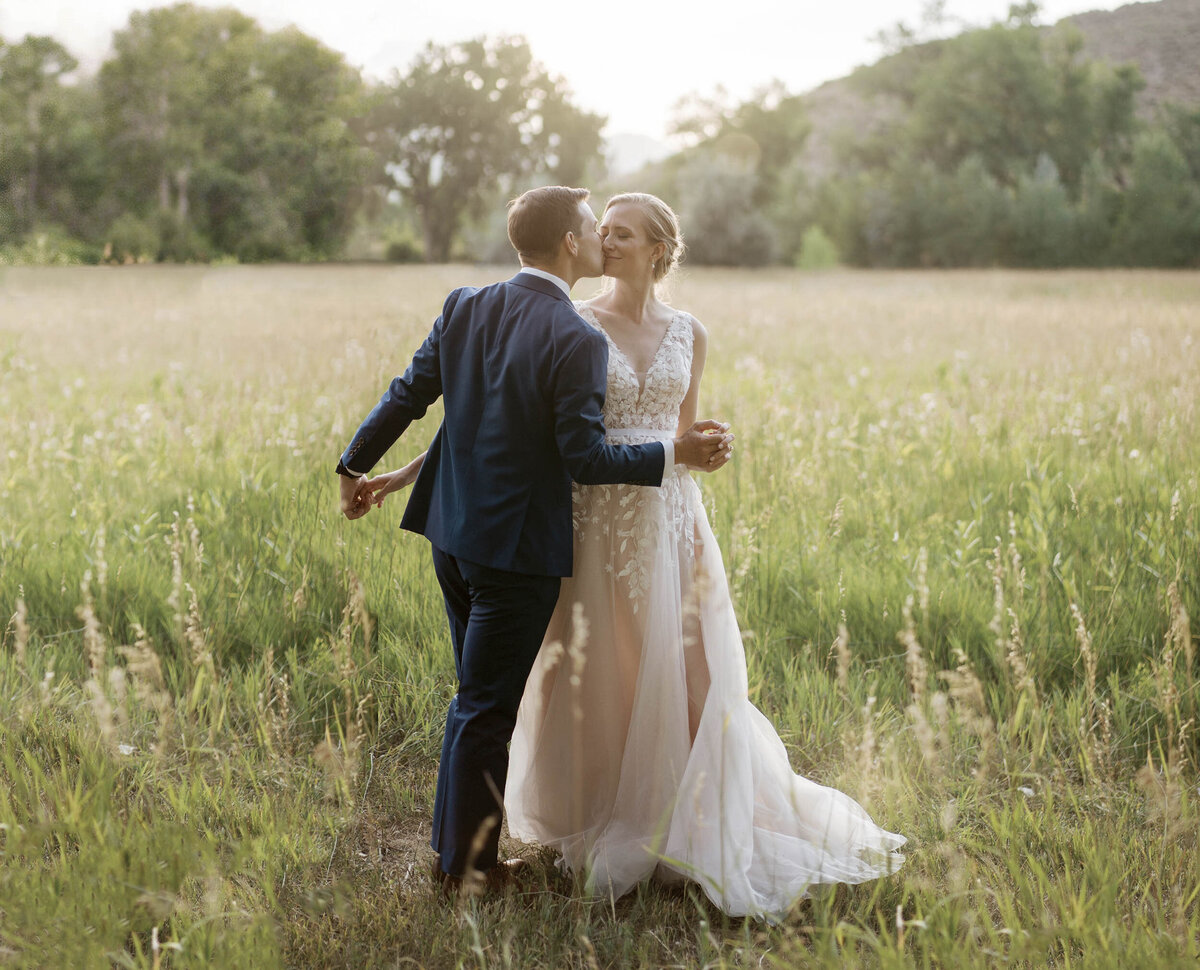 Outdoor Colorado Bride Kissing Groom