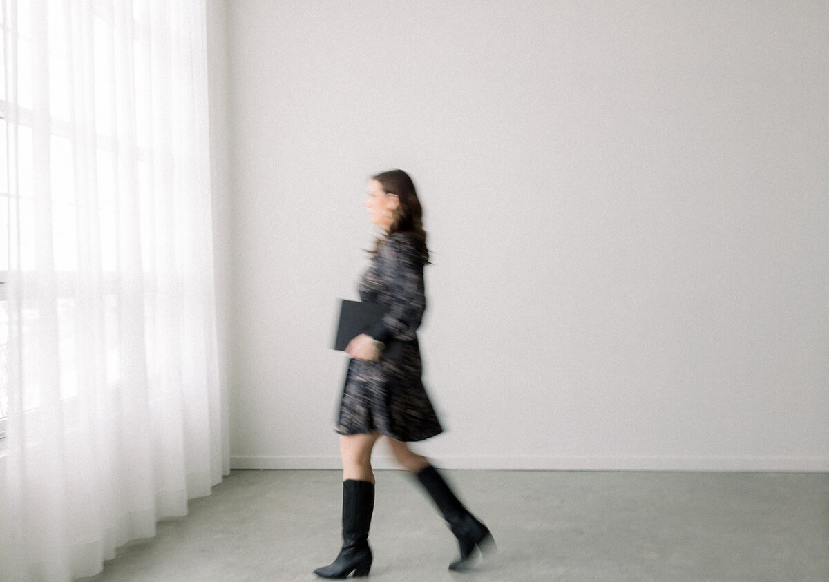 Business woman walking out of focus