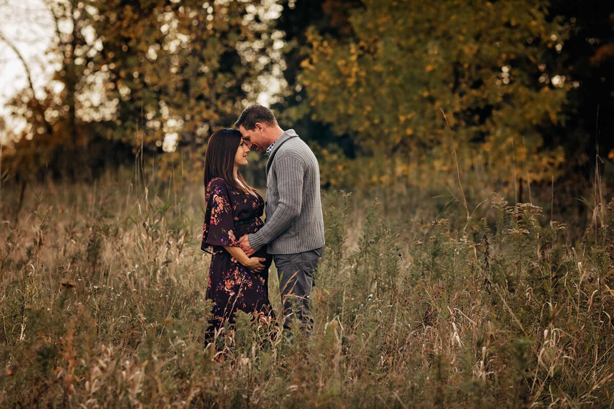london ontario expectant mom and dad in field with long grass