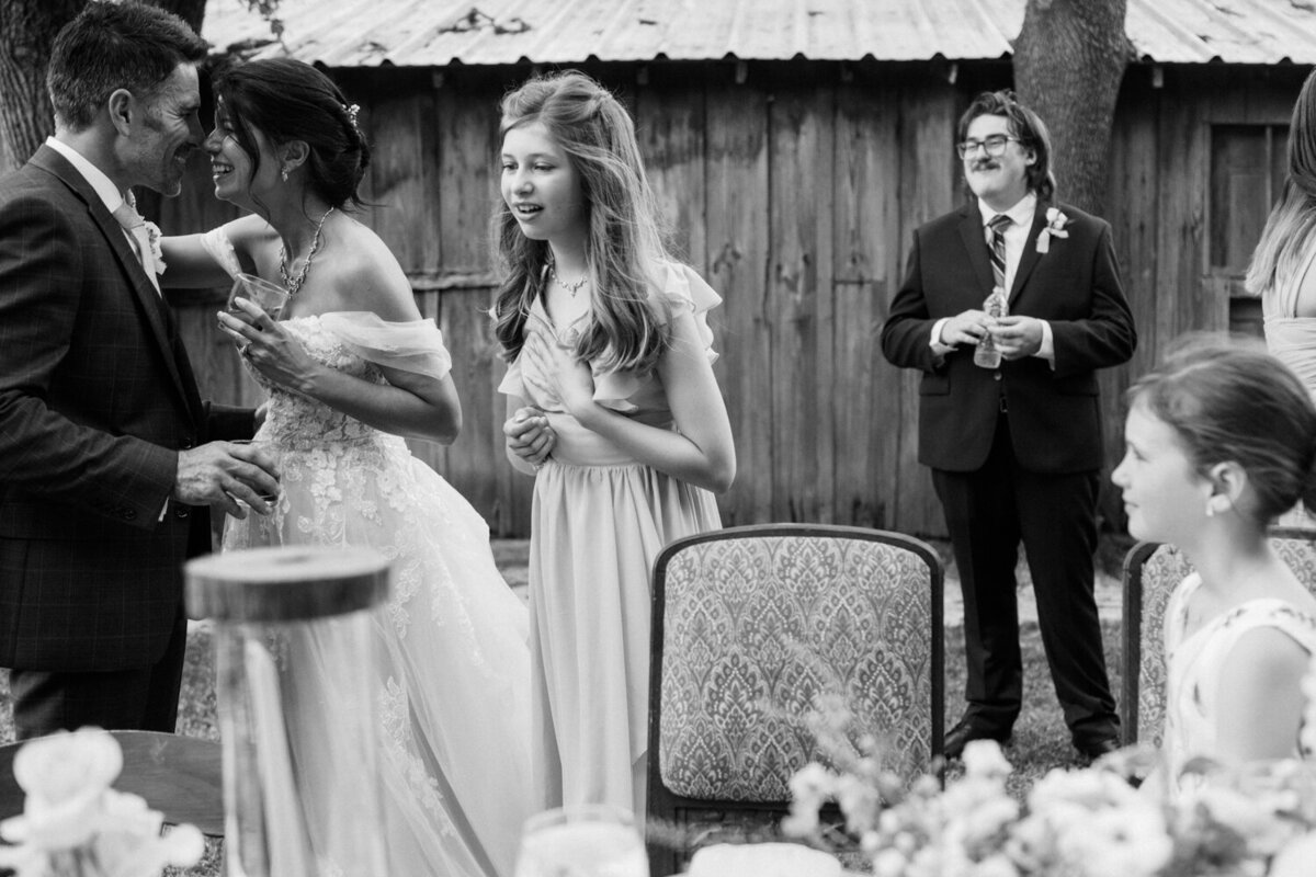 bride-and-groom-surrounded-by-children