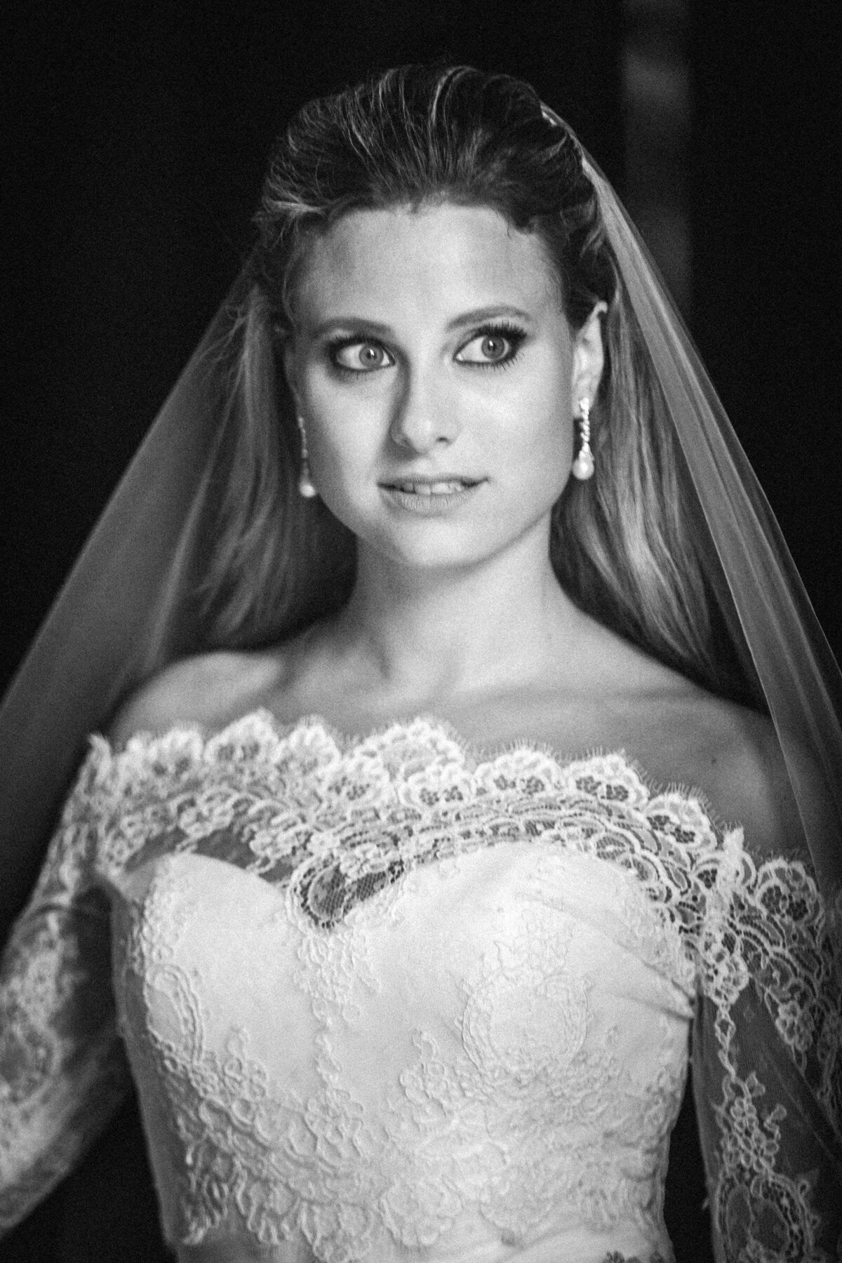Black and white photo of a bride looking off to the side