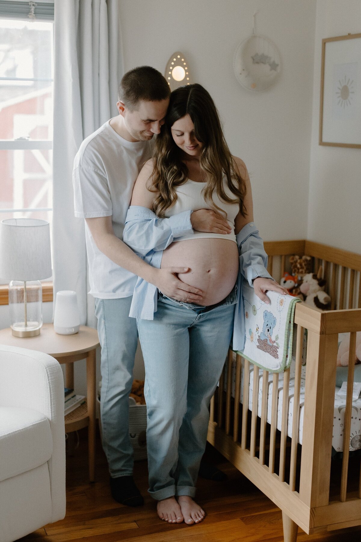 pregnant woman and man in nursery