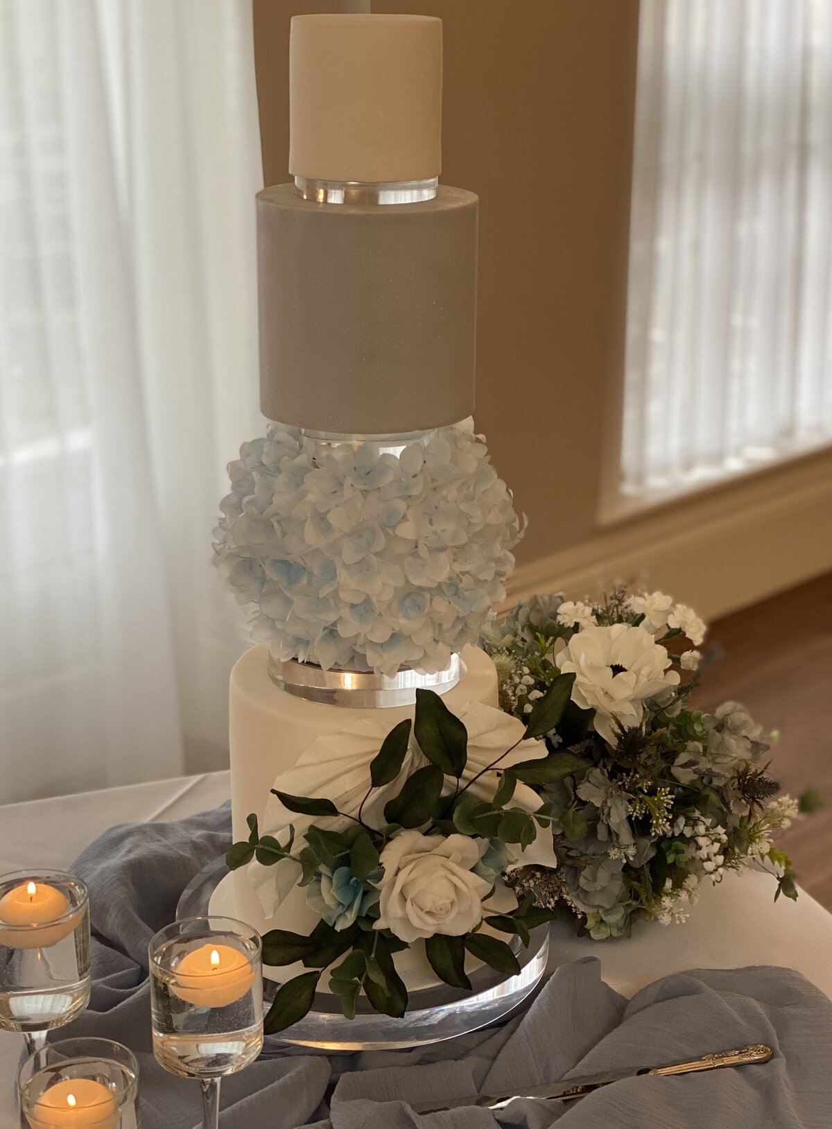 Blue and white wedding cake with wafer paper ball and sugar flowers