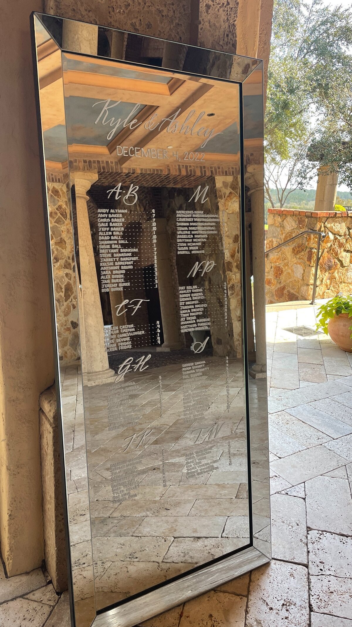 Silver framed rectangular mirror leaning against wall