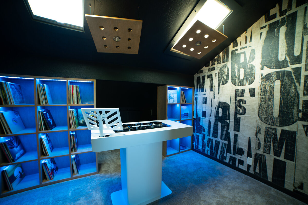 DJ room with vinyl records and turn tables