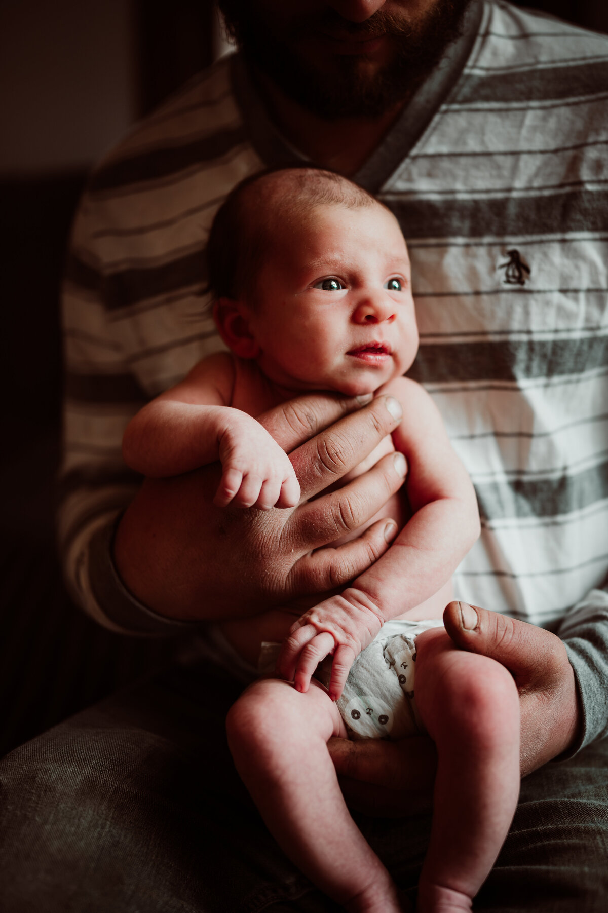 Natural newborn photo in soft neutral tones taken during Minneapolis newborn photography session.