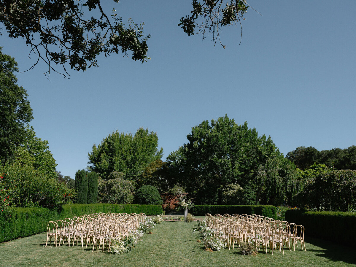 minimal and classic ceremony setup at filoli gardens, with theoni chairs.