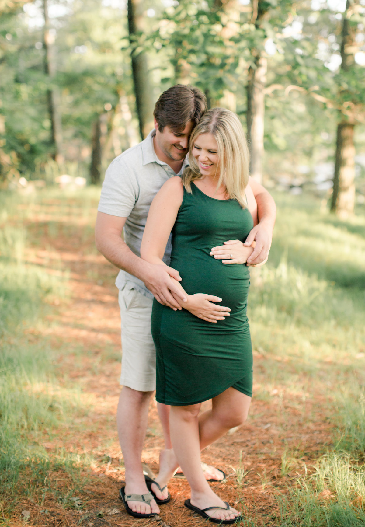 mathernity photography of parents in summer woods of brainerd minnesota