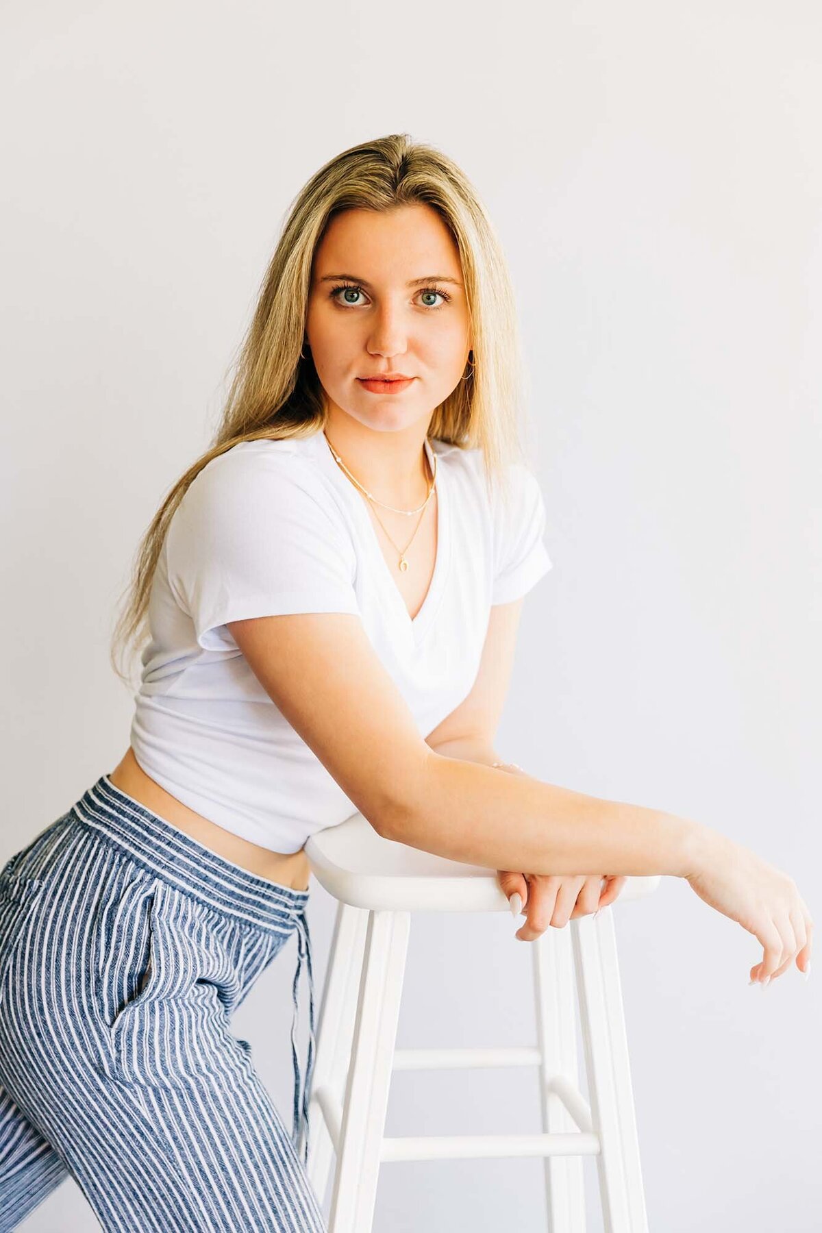 Studio portrait Montana model in striped pants, Kalispell, MT