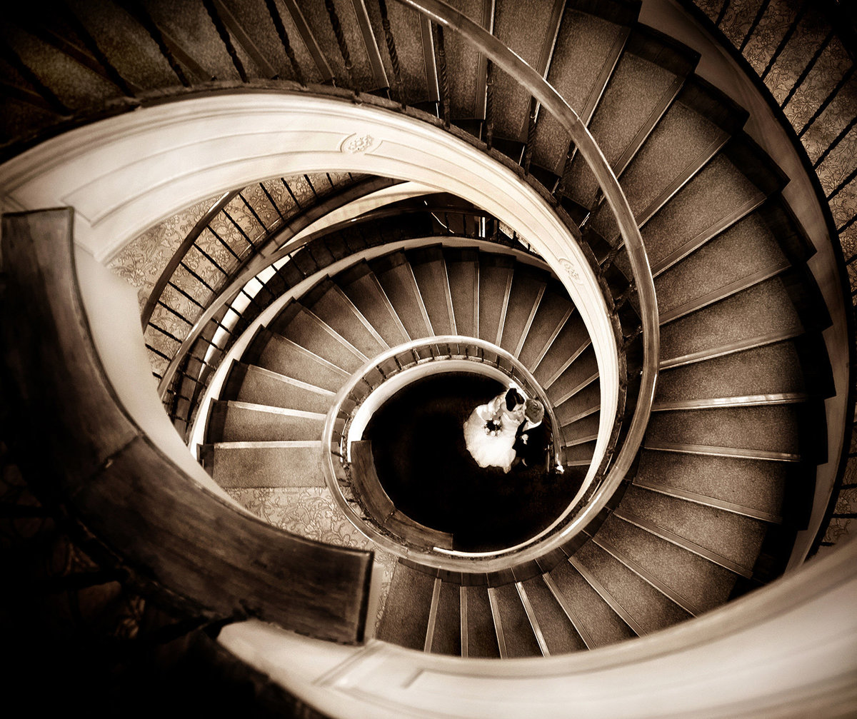 PHoto of a spiral staircase leading dwon