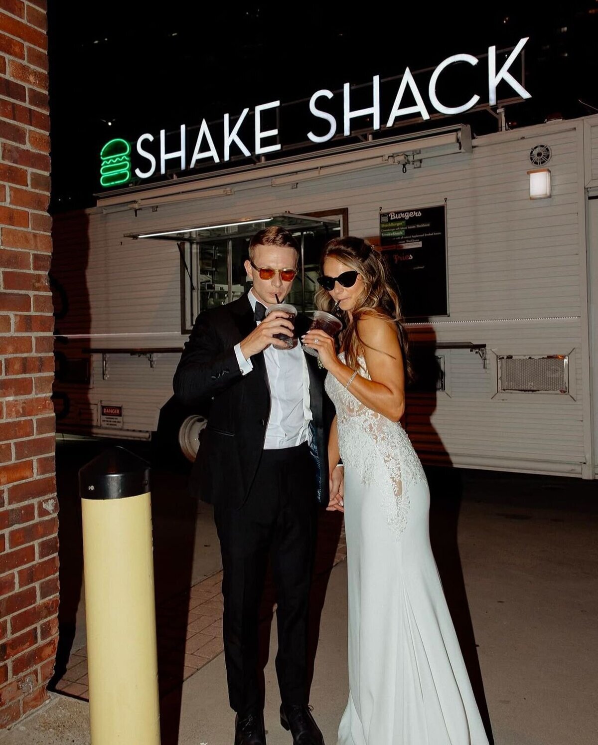 couple at the shake shack food truck of their luxury wedding in nyc