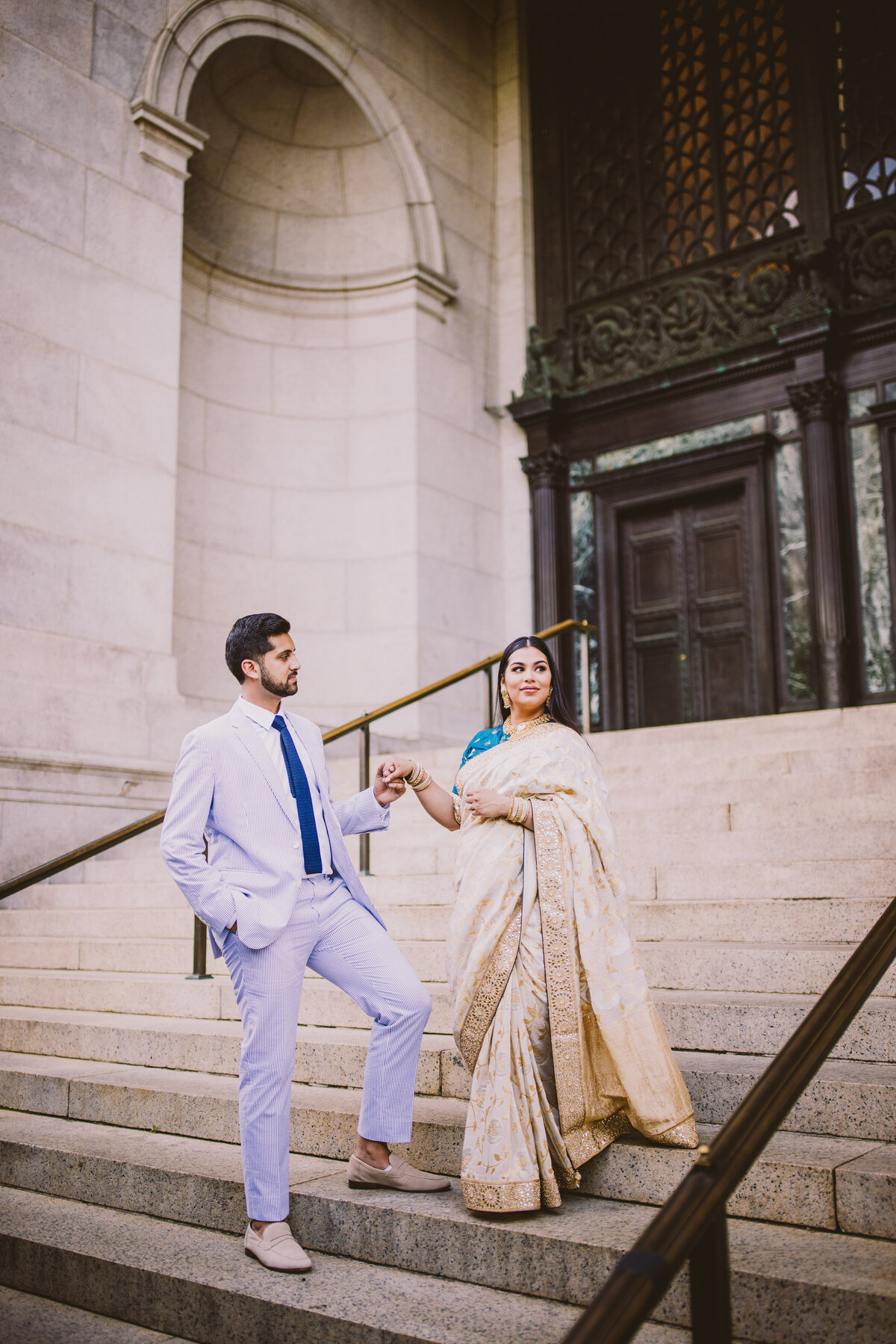 A couple walking down the steps of the natural history museum in nyc